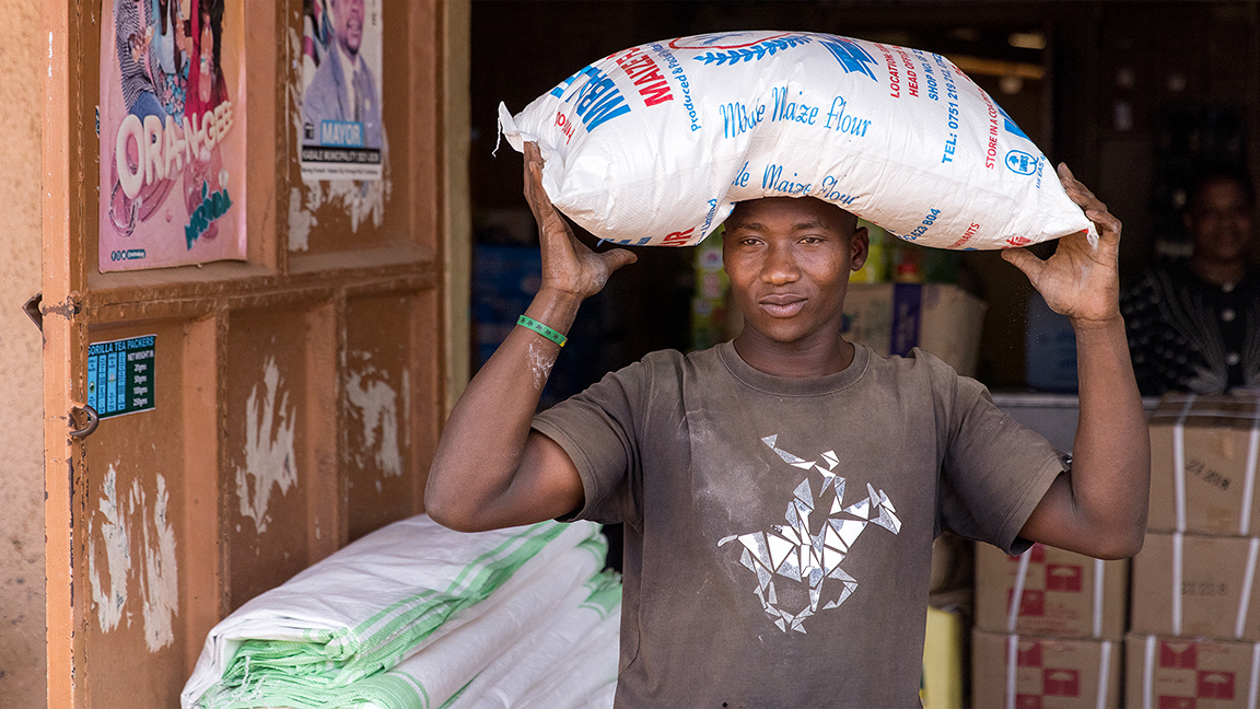 Twende Community Project Image Showing A Man Carrying Food